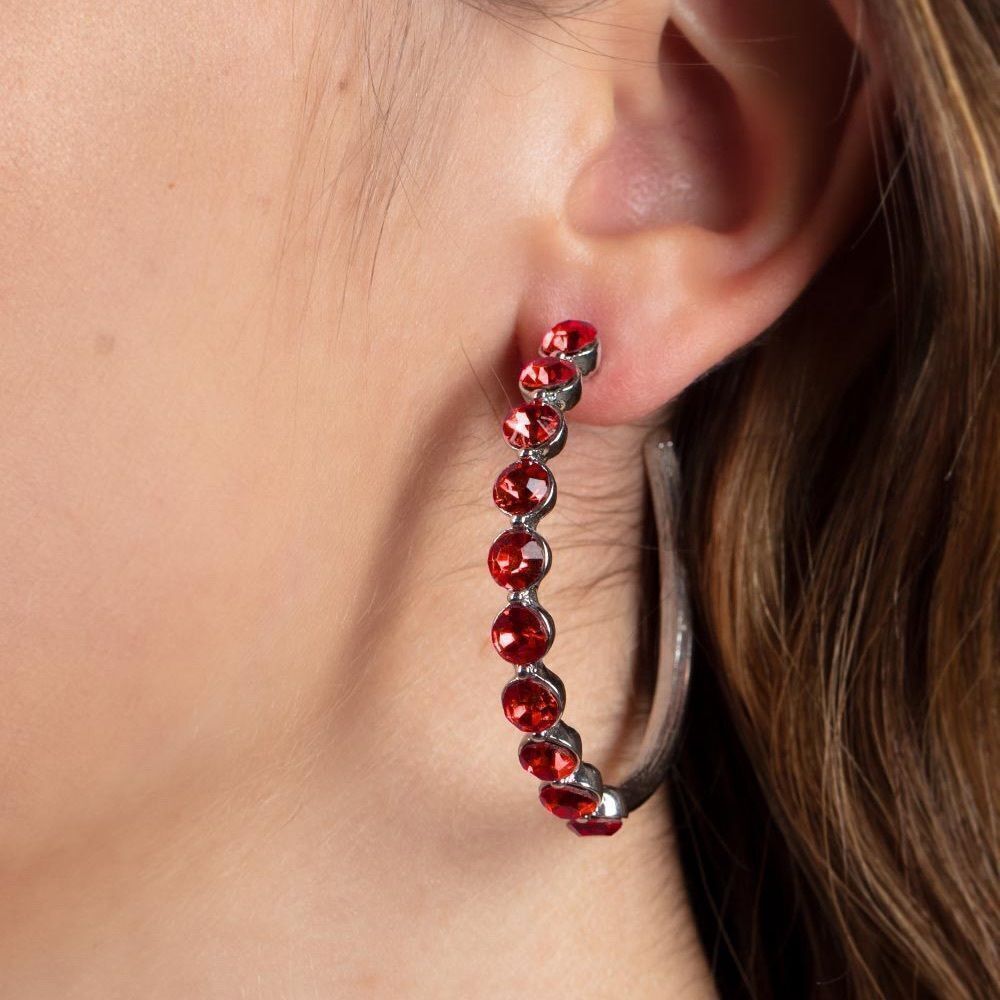 Silver metal color with red rhinestone hoop earrings. Medium to larger hoops